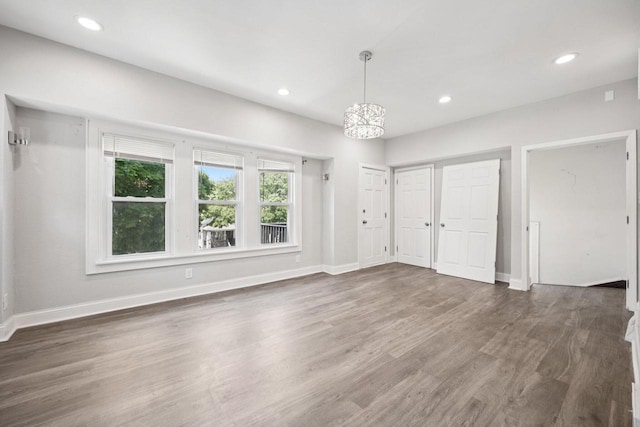 3936 N 14th St Unit 3938, Milwaukee, WI 53206 - unfurnished bedroom featuring wood finished floors and recessed lighting