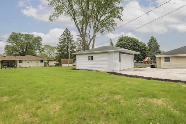 WW151N8656 Marshall Dr, Menomonee Falls, WI 53051 - view of green lawn featuring an outdoor structure and a detached garage