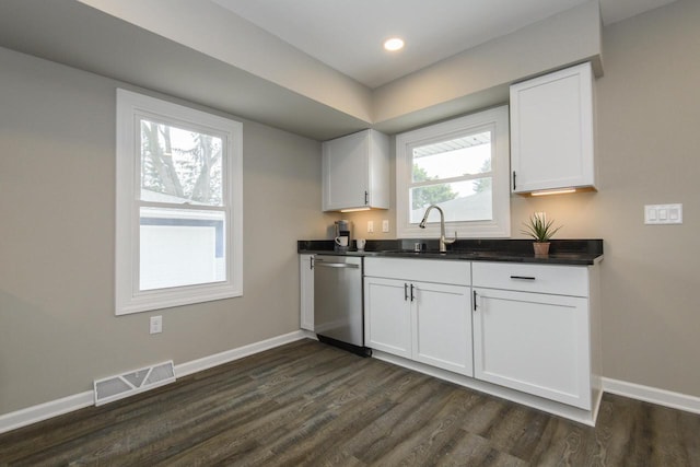 WW151N8656 Marshall Dr, Menomonee Falls, WI 53051 - kitchen featuring dishwasher, dark wood-style flooring, white cabinetry, dark countertops, and recessed lighting