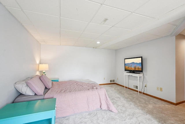 509 S 6th Ave, West Bend, WI 53095 - carpeted bedroom with a paneled ceiling and baseboards