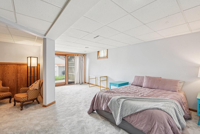 509 S 6th Ave, West Bend, WI 53095 - bedroom featuring a paneled ceiling, carpet floors, multiple windows, and access to outside