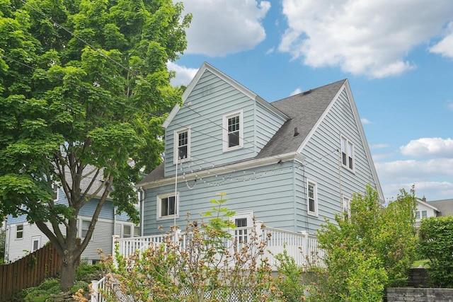 509 S 6th Ave, West Bend, WI 53095 - view of side of property featuring a shingled roof