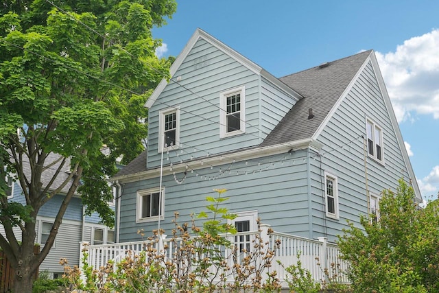 509 S 6th Ave, West Bend, WI 53095 - view of side of home with a shingled roof