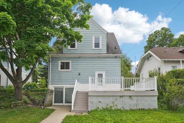 509 S 6th Ave, West Bend, WI 53095 - back of house featuring stairway, a wooden deck, a yard, and a shingled roof