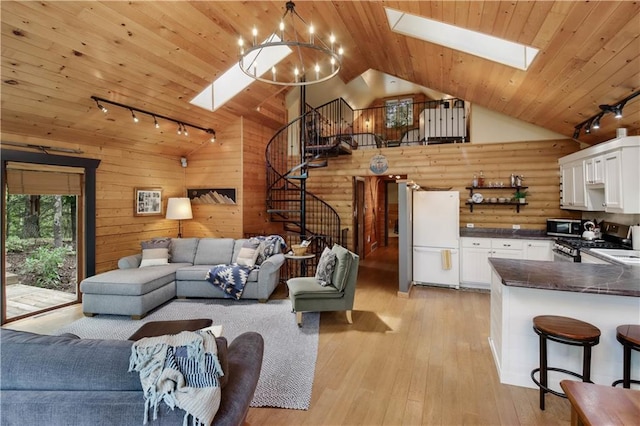 5683N Ham-Holly Dr, Stone Lake, WI 54876 - living room featuring rail lighting, a skylight, stairs, vaulted ceiling, and wooden ceiling
