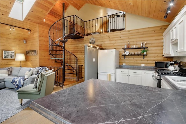 5683N Ham-Holly Dr, Stone Lake, WI 54876 - kitchen with stainless steel appliances, wood finished floors, a skylight, wooden ceiling, and white cabinets