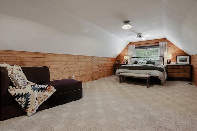 5683N Ham-Holly Dr, Stone Lake, WI 54876 - carpeted bedroom featuring wood walls, vaulted ceiling, and ceiling fan