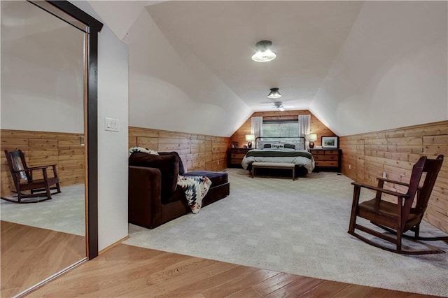 5683N Ham-Holly Dr, Stone Lake, WI 54876 - bedroom with wood walls, wood finished floors, and vaulted ceiling