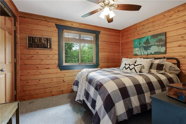 5683N Ham-Holly Dr, Stone Lake, WI 54876 - carpeted bedroom featuring wooden walls and a ceiling fan