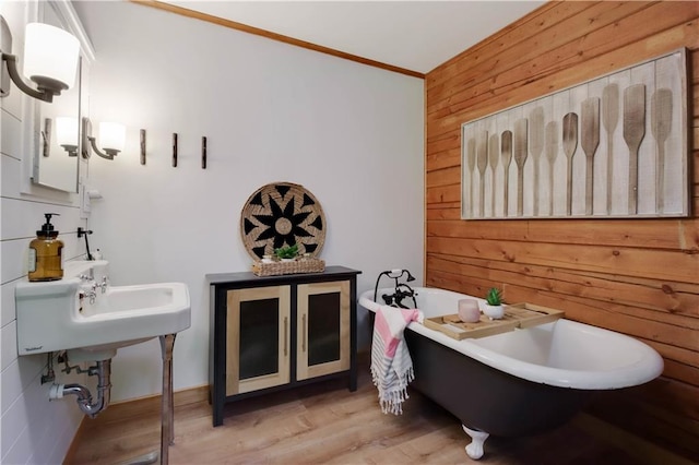 5683N Ham-Holly Dr, Stone Lake, WI 54876 - full bathroom featuring wood walls, a freestanding tub, crown molding, and wood finished floors