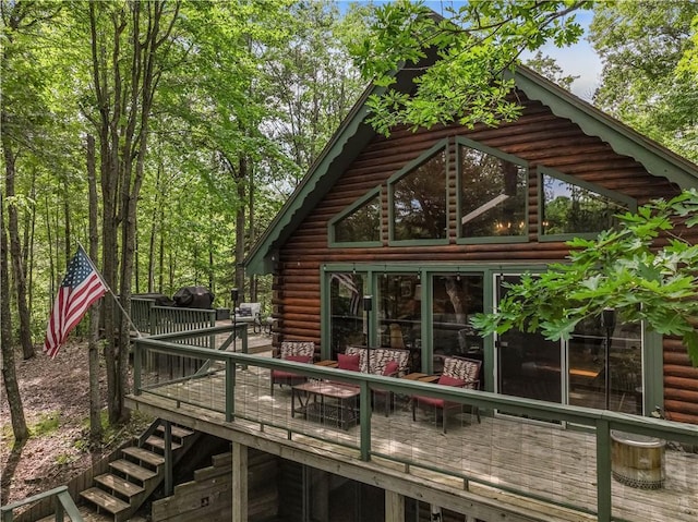 5683N Ham-Holly Dr, Stone Lake, WI 54876 - view of side of property with log siding and a wooden deck