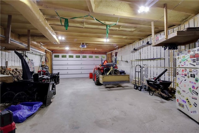 5683N Ham-Holly Dr, Stone Lake, WI 54876 - garage featuring freestanding refrigerator