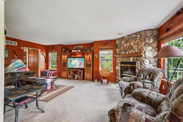 8216 Anna Ave, Wind Lake, WI 53185 - carpeted living area with plenty of natural light and a stone fireplace