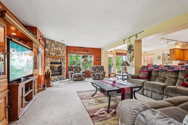 8216 Anna Ave, Wind Lake, WI 53185 - living area featuring carpet flooring, track lighting, and a stone fireplace