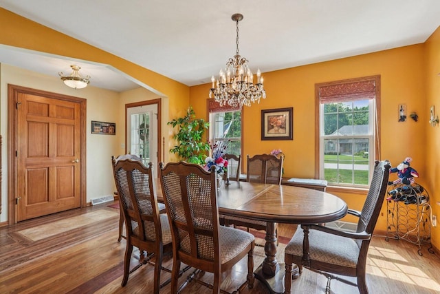 8216 Anna Ave, Wind Lake, WI 53185 - dining area with a chandelier and wood finished floors