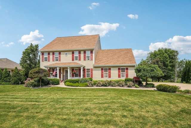 8216 Anna Ave, Wind Lake, WI 53185 - colonial house with covered porch and a front lawn