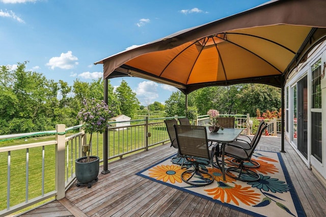 8216 Anna Ave, Wind Lake, WI 53185 - deck with a gazebo, outdoor dining area, a yard, and view of wooded area