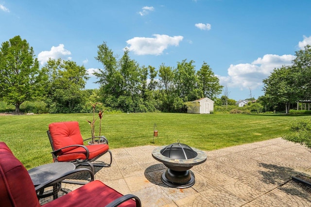 8216 Anna Ave, Wind Lake, WI 53185 - view of patio / terrace with an outdoor fire pit and a storage shed