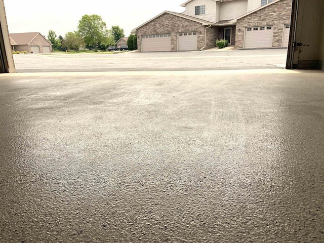 1216 Pond View Cir, De Pere, WI 54115 - view of yard with concrete driveway and an attached garage