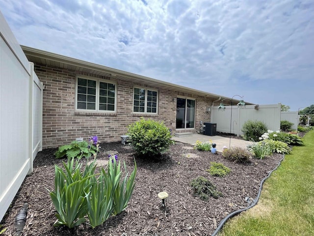 1216 Pond View Cir, De Pere, WI 54115 - rear view of property featuring brick siding and a patio area