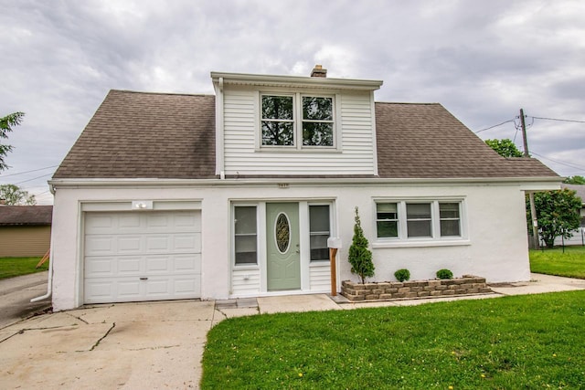 1617 Sauk Trail Rd, Sheboygan, WI 53081 - traditional home with roof with shingles, a chimney, concrete driveway, and a garage