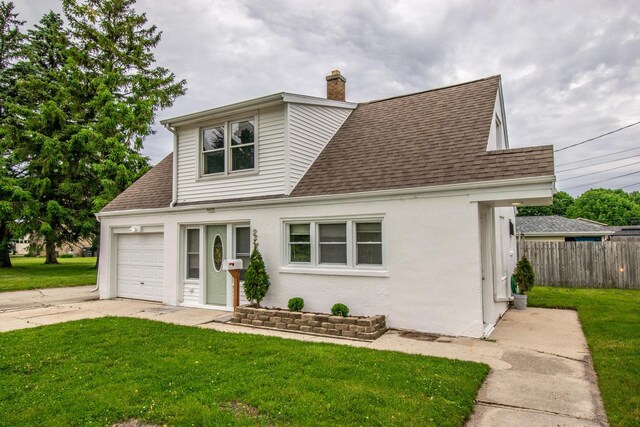 1617 Sauk Trail Rd, Sheboygan, WI 53081 - traditional home featuring roof with shingles, an attached garage, a chimney, and driveway