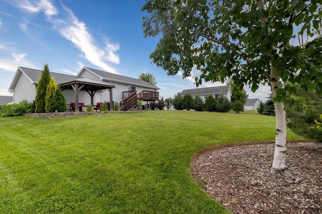 2137 Olde Country Cir, Kaukauna, WI 54130 - view of grassy yard featuring a gazebo and a wooden deck