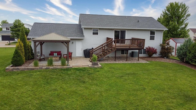 2137 Olde Country Cir, Kaukauna, WI 54130 - back of property with a patio area, a gazebo, a shingled roof, and a yard
