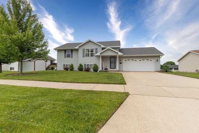 2137 Olde Country Cir, Kaukauna, WI 54130 - split level home featuring a garage, a front lawn, concrete driveway, and roof with shingles