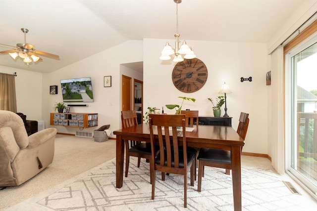 2137 Olde Country Cir, Kaukauna, WI 54130 - dining area featuring a chandelier, light colored carpet, lofted ceiling, and a ceiling fan