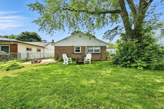 5628 W Montana St, Milwaukee, WI 53219 - rear view of house with brick siding and a fire pit