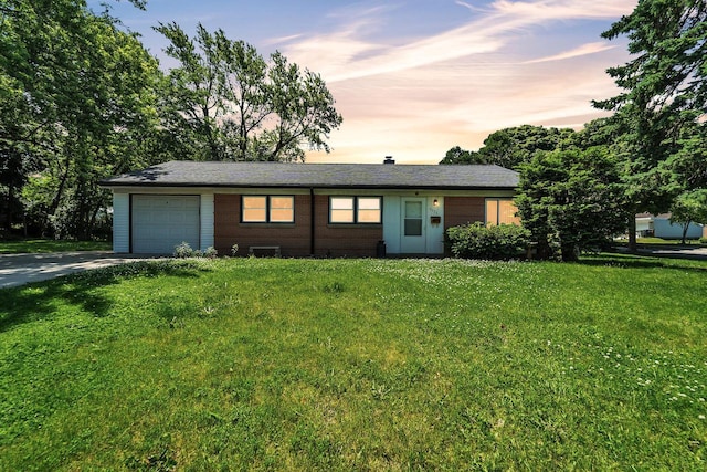 5531 W Stack Dr, Milwaukee, WI 53219 - ranch-style house featuring a garage, concrete driveway, and a front yard