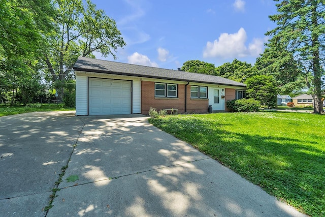 5531 W Stack Dr, Milwaukee, WI 53219 - ranch-style home with an attached garage, concrete driveway, brick siding, and a front lawn