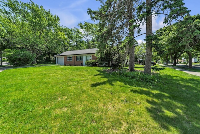 5531 W Stack Dr, Milwaukee, WI 53219 - view of grassy yard featuring an attached garage