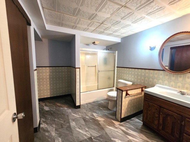 1528 Taylor Ave, Racine, WI 53403 - full bathroom featuring vanity, a wainscoted wall, and combined bath / shower with glass door