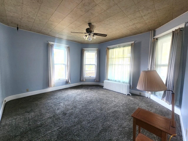 1528 Taylor Ave, Racine, WI 53403 - carpeted empty room with radiator and a ceiling fan
