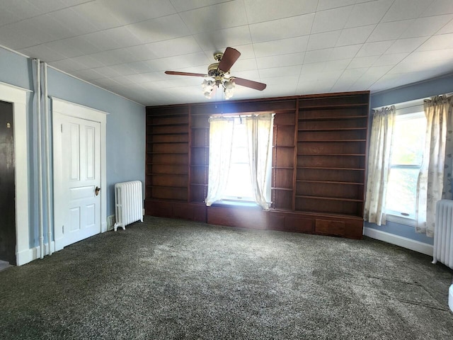 1528 Taylor Ave, Racine, WI 53403 - unfurnished room with radiator, carpet floors, ceiling fan, and built in shelves