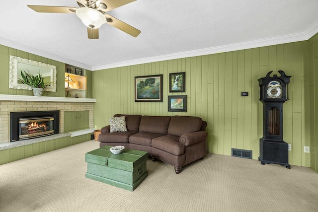 1242 E Edgewood Dr, Appleton, WI 54913 - carpeted living area with ornamental molding, a brick fireplace, and a ceiling fan