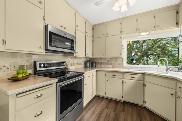 1242 E Edgewood Dr, Appleton, WI 54913 - kitchen with appliances with stainless steel finishes, dark wood finished floors, and light countertops
