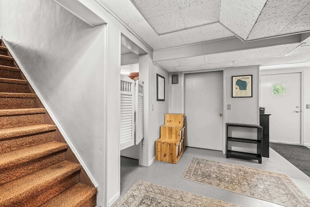 1242 E Edgewood Dr, Appleton, WI 54913 - below grade area with a paneled ceiling and stairs