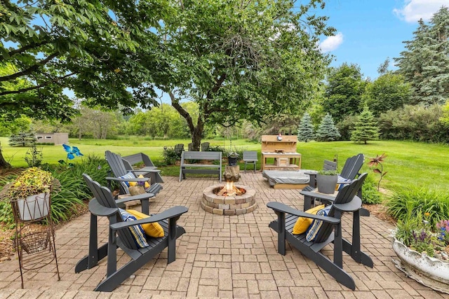 1242 E Edgewood Dr, Appleton, WI 54913 - view of patio / terrace featuring a fire pit, area for grilling, and view of wooded area