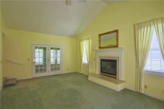 1410 Forest Knoll Ct, Eau Claire, WI 54701 - unfurnished living room featuring carpet floors, lofted ceiling, a high end fireplace, and french doors