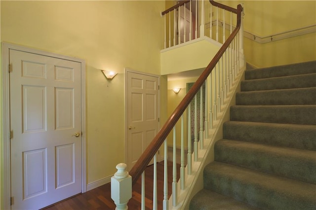 1410 Forest Knoll Ct, Eau Claire, WI 54701 - stairs featuring wood finished floors and a towering ceiling