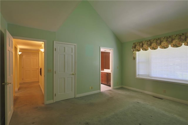 1410 Forest Knoll Ct, Eau Claire, WI 54701 - unfurnished bedroom with carpet, ensuite bath, and high vaulted ceiling