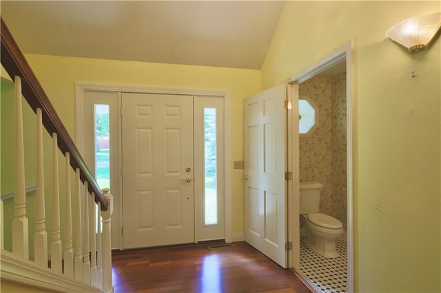1410 Forest Knoll Ct, Eau Claire, WI 54701 - foyer with dark wood-type flooring, healthy amount of natural light, stairs, and vaulted ceiling
