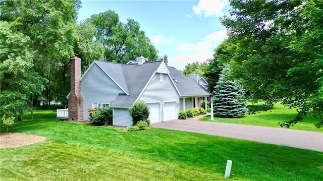 1410 Forest Knoll Ct, Eau Claire, WI 54701 - view of front of property with a front lawn, driveway, an attached garage, and a chimney