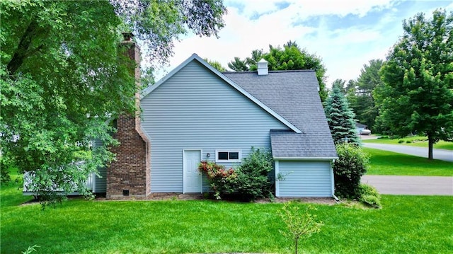 1410 Forest Knoll Ct, Eau Claire, WI 54701 - view of property exterior featuring a yard, a chimney, and roof with shingles
