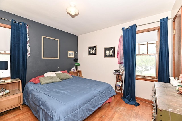 2954 S 48th St, Milwaukee, WI 53219 - bedroom with light wood-style floors and baseboards