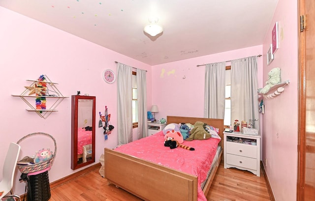 2954 S 48th St, Milwaukee, WI 53219 - bedroom featuring light wood-style flooring and baseboards