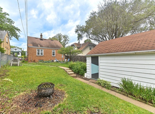 2954 S 48th St, Milwaukee, WI 53219 - view of yard featuring an outdoor fire pit and an outbuilding